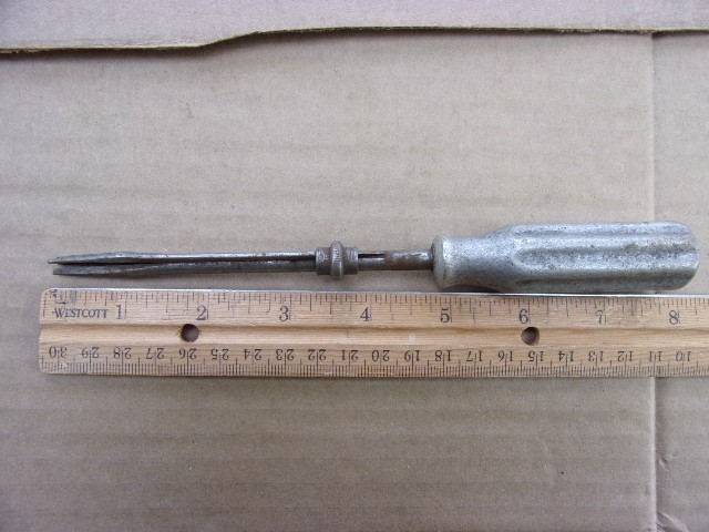 vintage flathead holding screwdriver cast handle