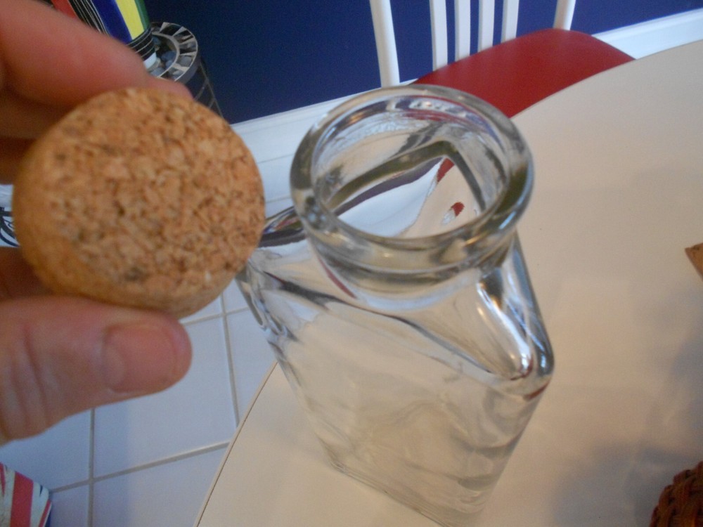 bottle with cork topper three flat sided 1999 issue 9 3/4" tall
