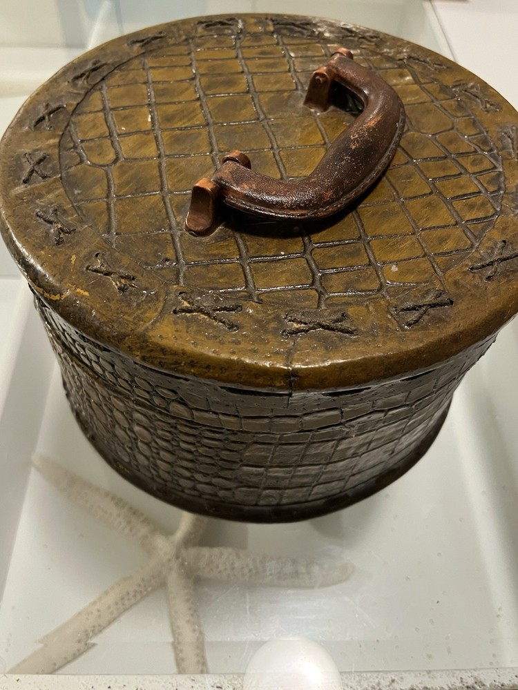 Wood basket with alligator pattern and silk lining.