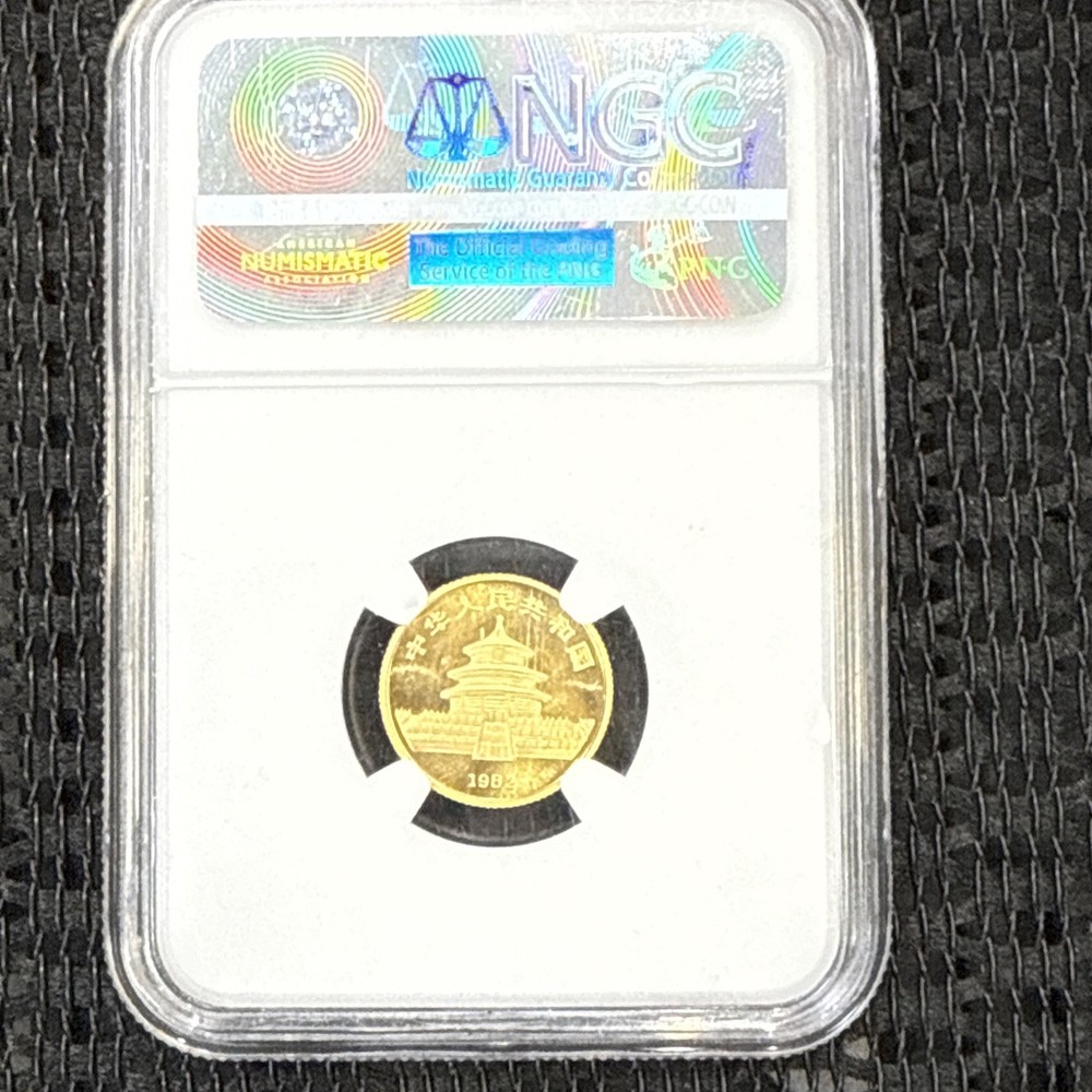 1982 CHINA 1/10TH OZ. GOLD PANDA SHORT LEAF NGC MS69