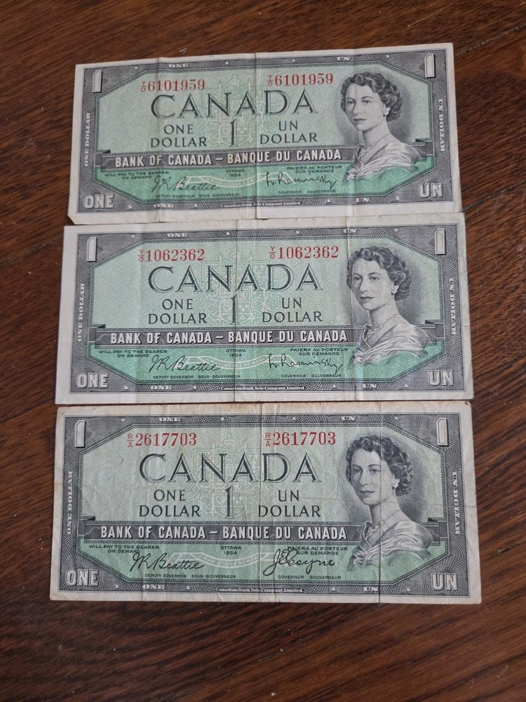 Three 1954 Canadian One Dollar Bills