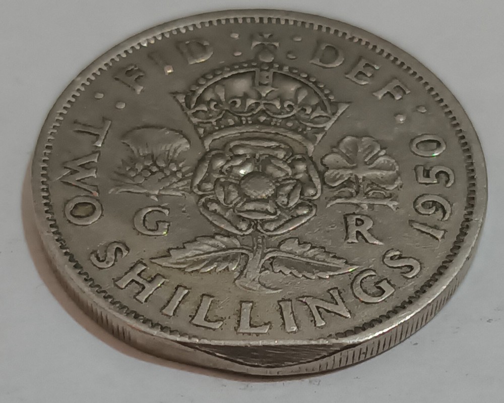 George V and George VI coins with error