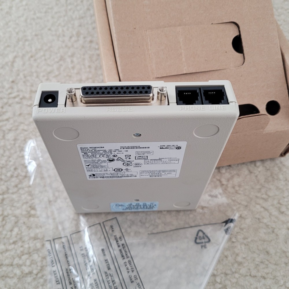 Multitech Systems Multi Modem Model: MT5634ZBA 56Kbps Data/Fax with accessories.