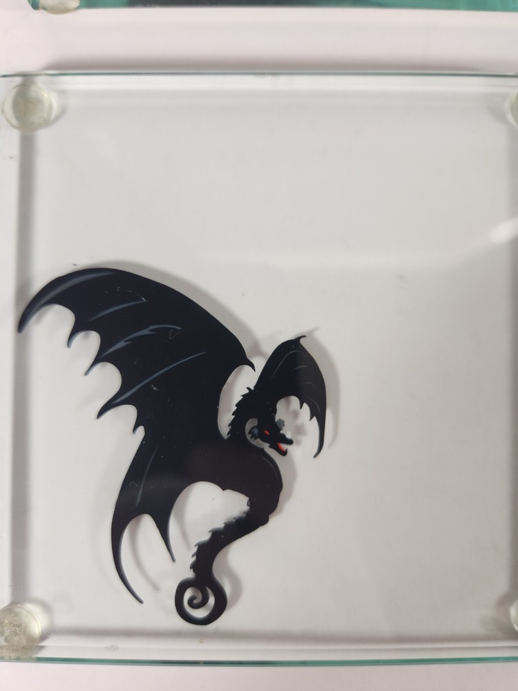 Glass Coasters With Dragon Silhouettes