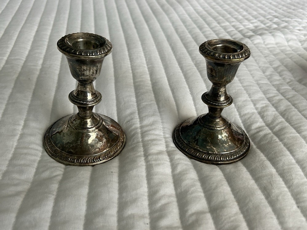 poole sterling  weighted #299 candle stick,,,, 1 solid —1 dented