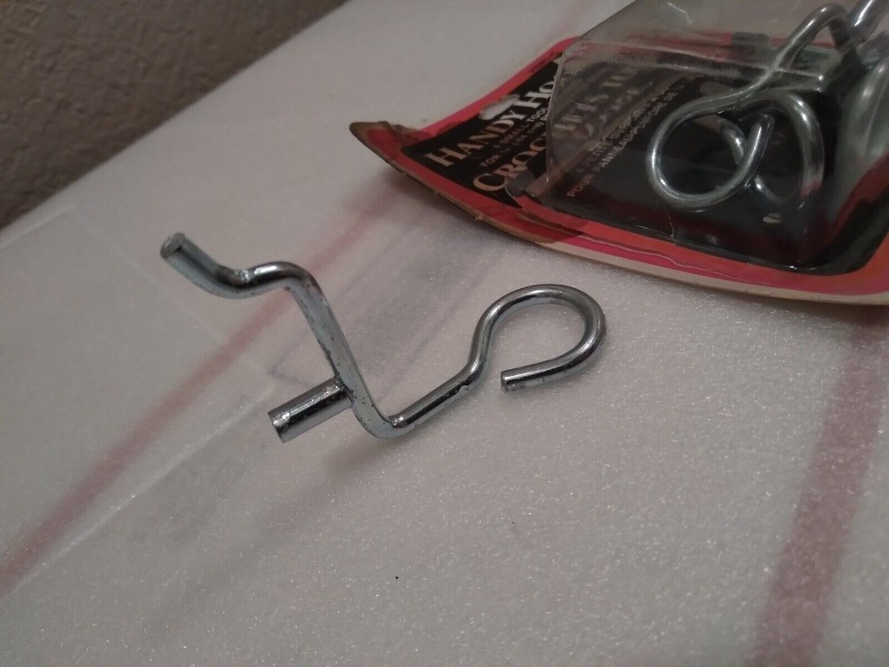 Lot of assorted NOS pegboard tool holders for 1/4" board