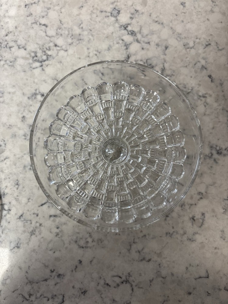 Clear pressed glass covered compote in the 'Cut Log' pattern.