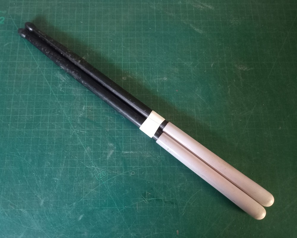 Unbranded nylon, carbon, white grip, drum sticks
