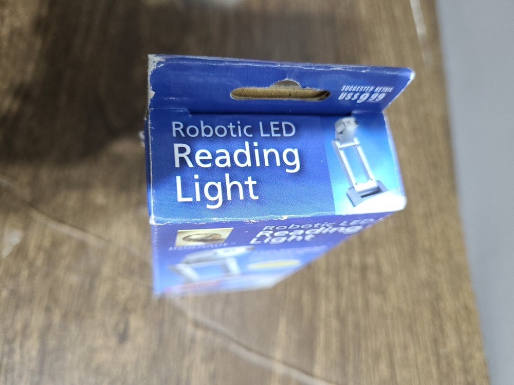 Robotic Led Reading Light Includes 3 Button Cell Batteries.
