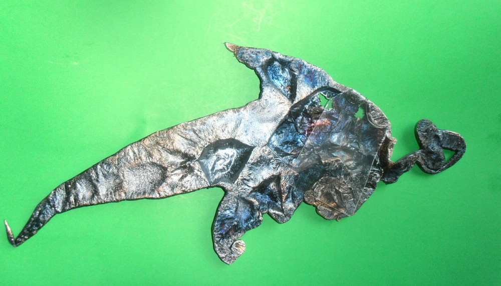 MODERN ART MOLTEN ALUMINUM SPILL FISH CHASING BAIT
