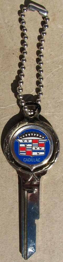 NOS CADILLAC LOGO KEY UNCUT PRISTINE CONDITION #H531