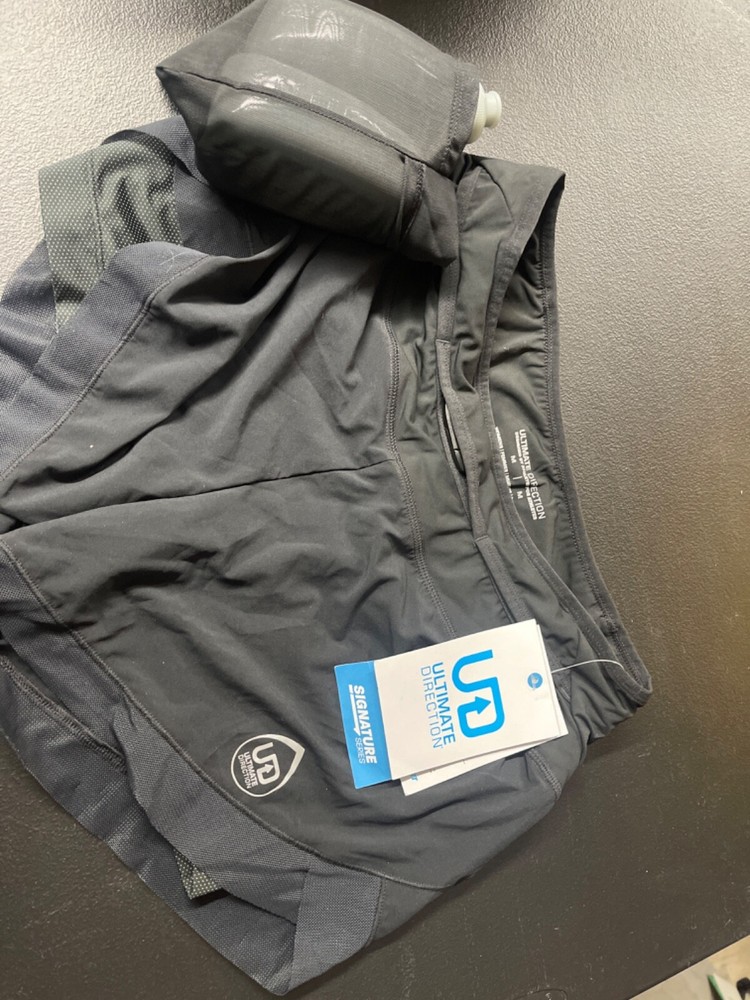 Ultmate Direction Athlete running shorts with water bottles
