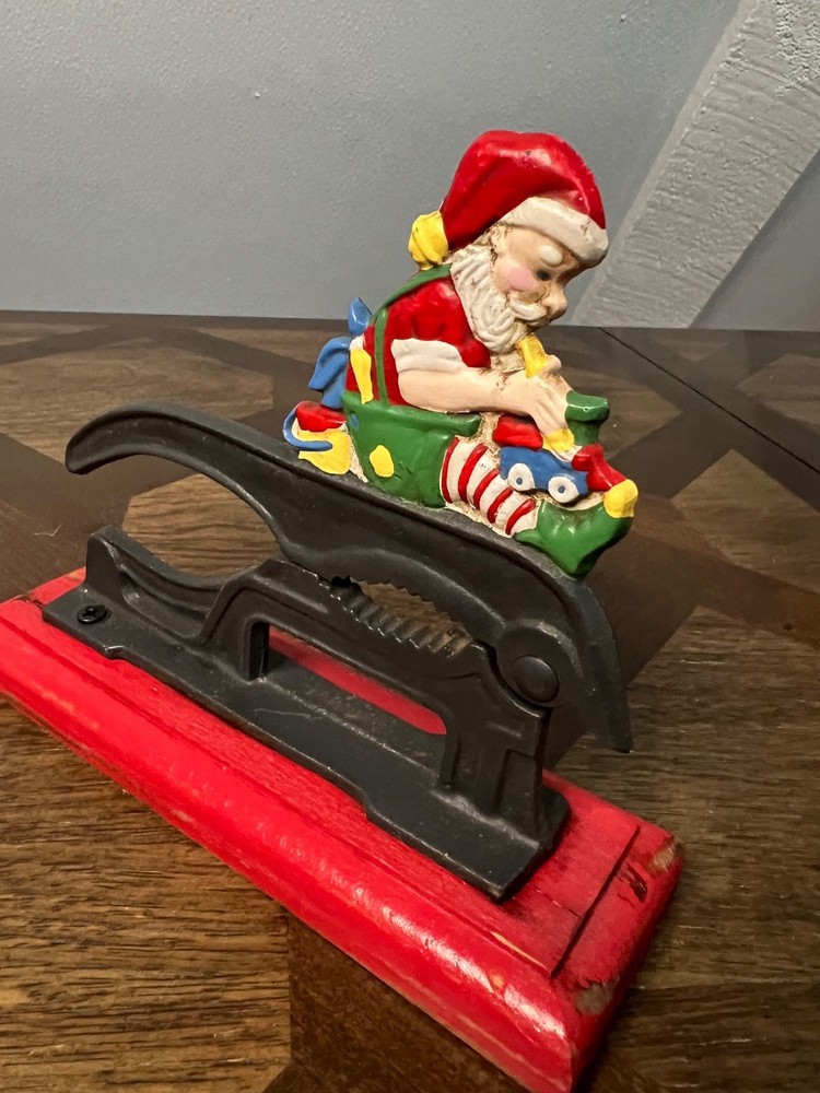 Old Fashioned Nutcracker Cast Iron on Wood Base santa theme nutcracker vintage
