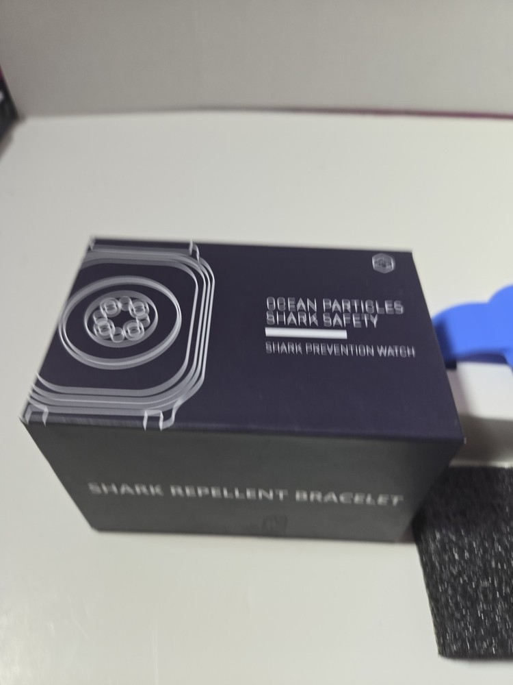 Ocean Particles Shark Repellent Bracelet, Blue Opened Box