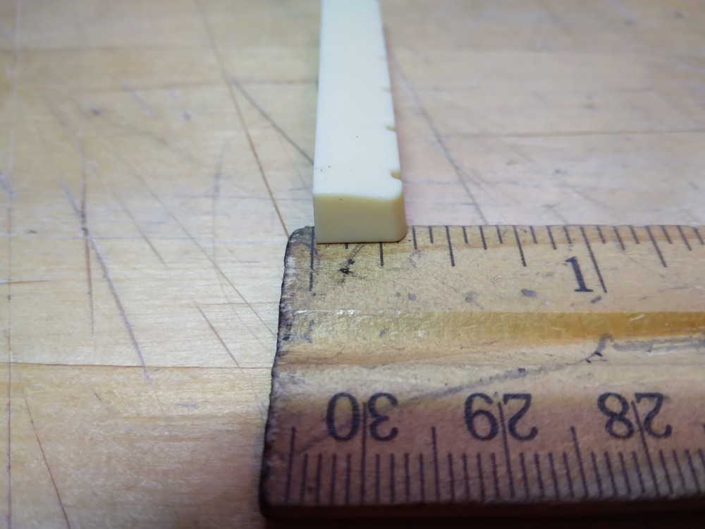 Vintage unbranded Plastic guitar Nut, white