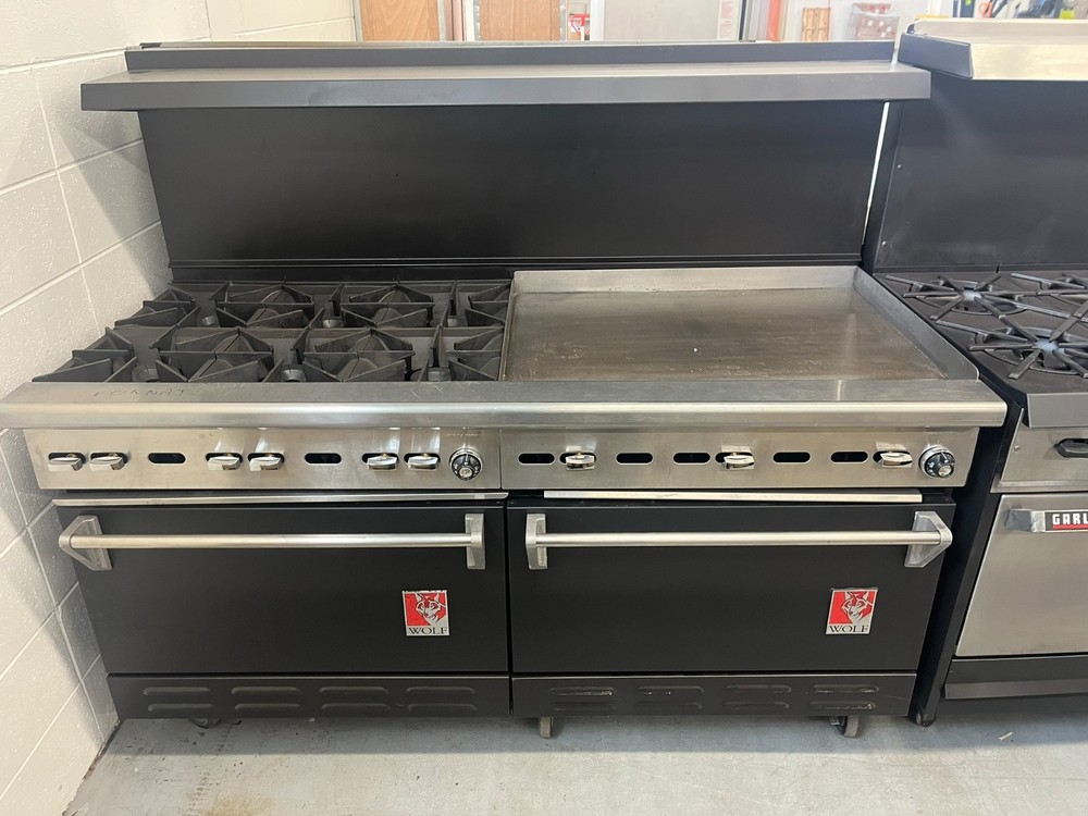 Wolf 6 burner and 33" Griddle with a double door oven