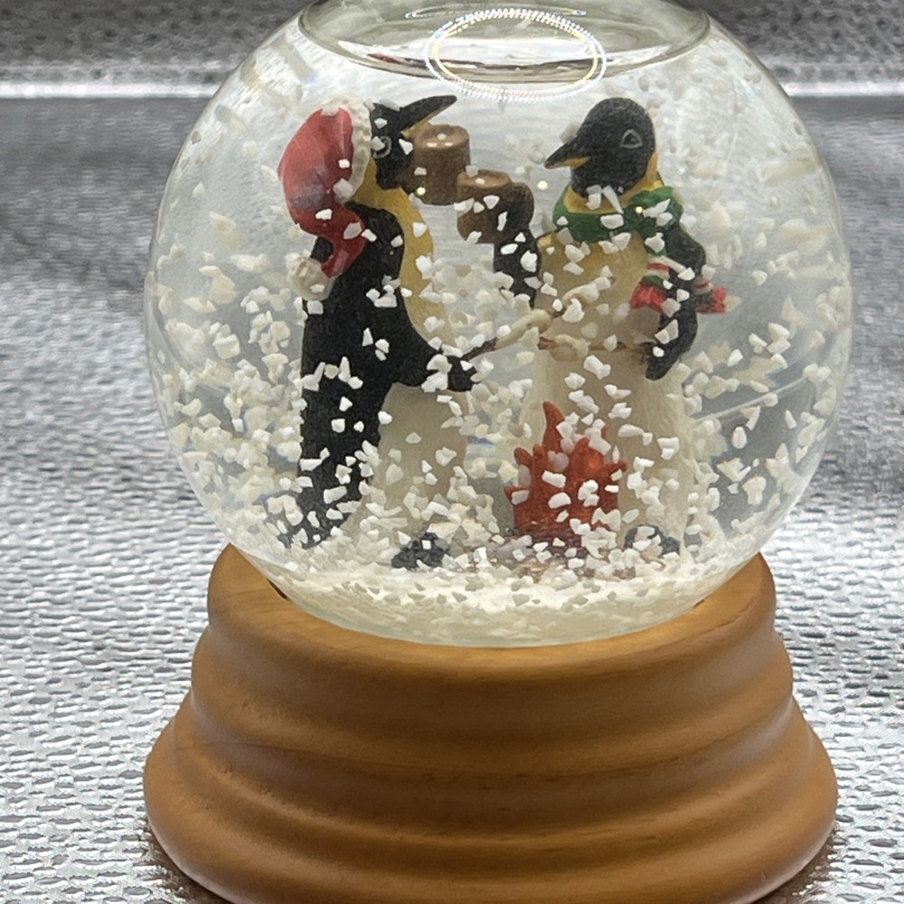 Eddie Bauer Penguin Snow globe 2002 Open Fire Roasting Marshmallows