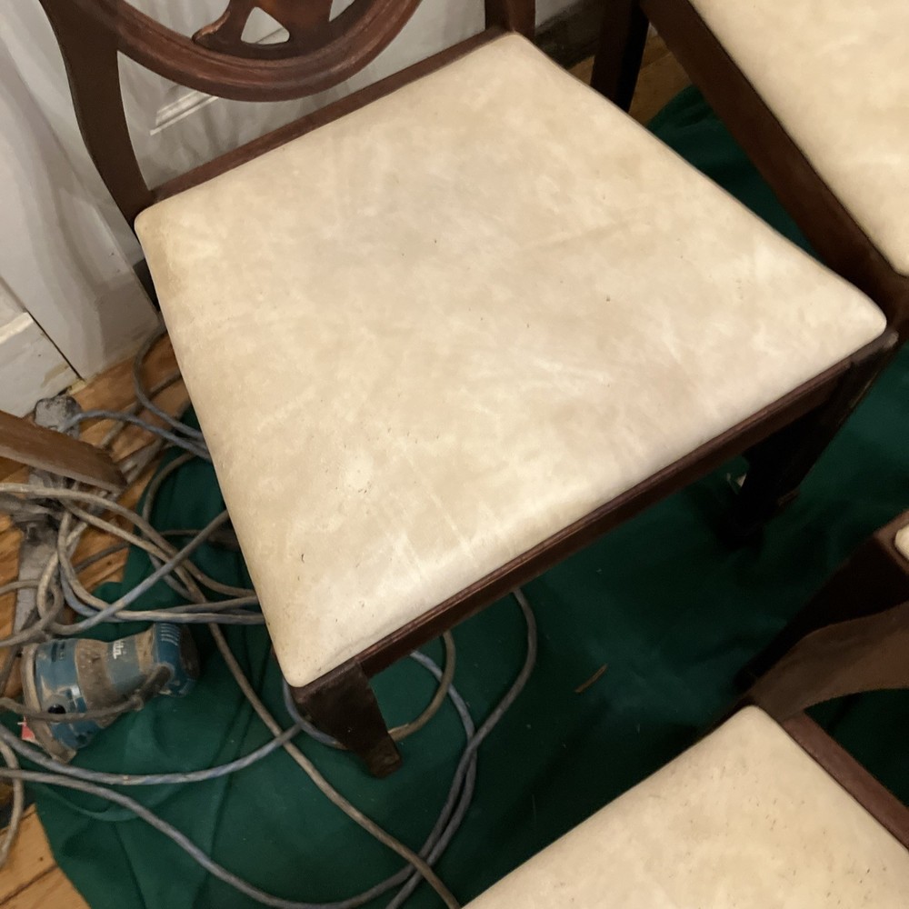 Four matching shield back mahogany dining room chairs