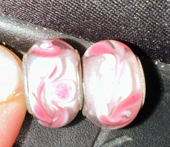 two matching pink patterned charms For Charm Braeclets