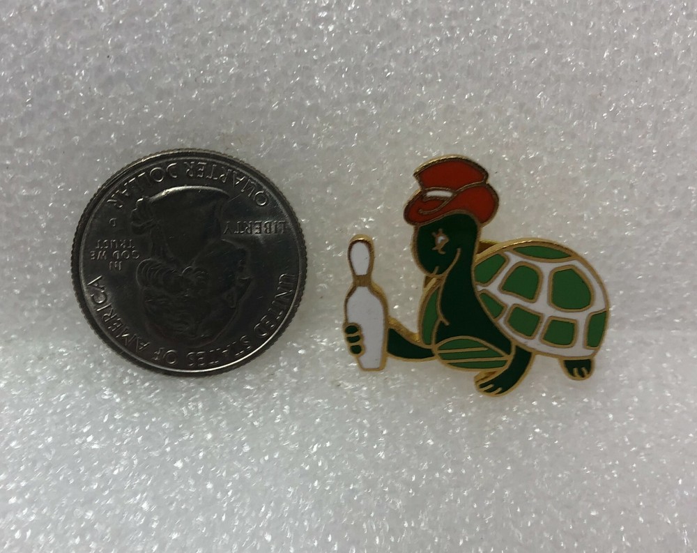 Turtle Holding Bowling Pin