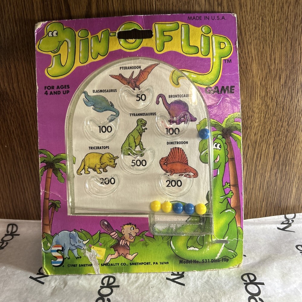 Vintage 1987 Din-o-Flip Handheld Game.