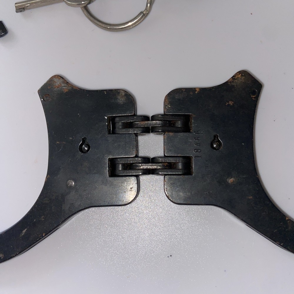 Vintage Peerless Hinge-Linked Handcuffs & Key On Monadnock Persuader