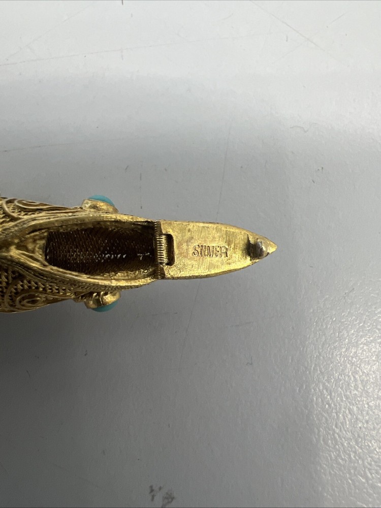 Tested as silver and gilded flexible fish, possibly pill box.