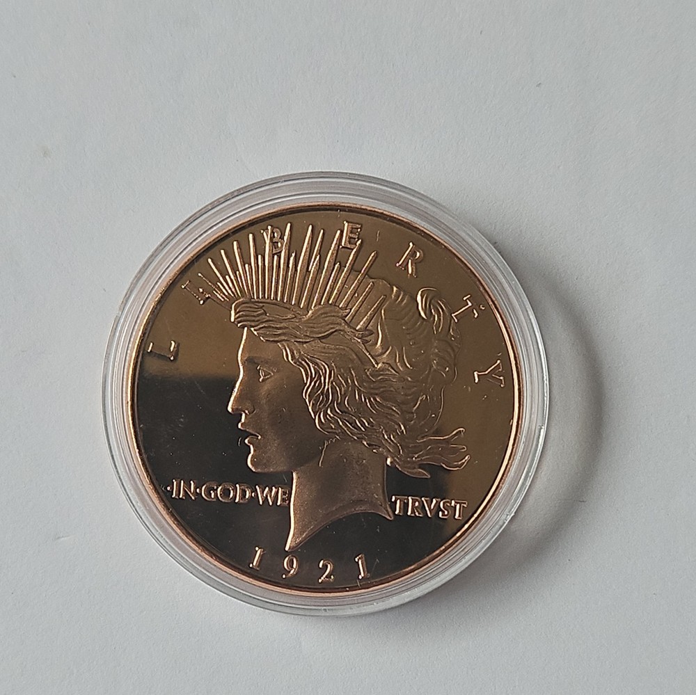 1 oz .999 Fine Copper Peace Dollar Round.