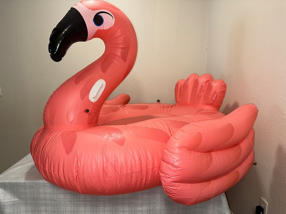 Flamingo Inflatable Pool Float Ride On with handers on each side.