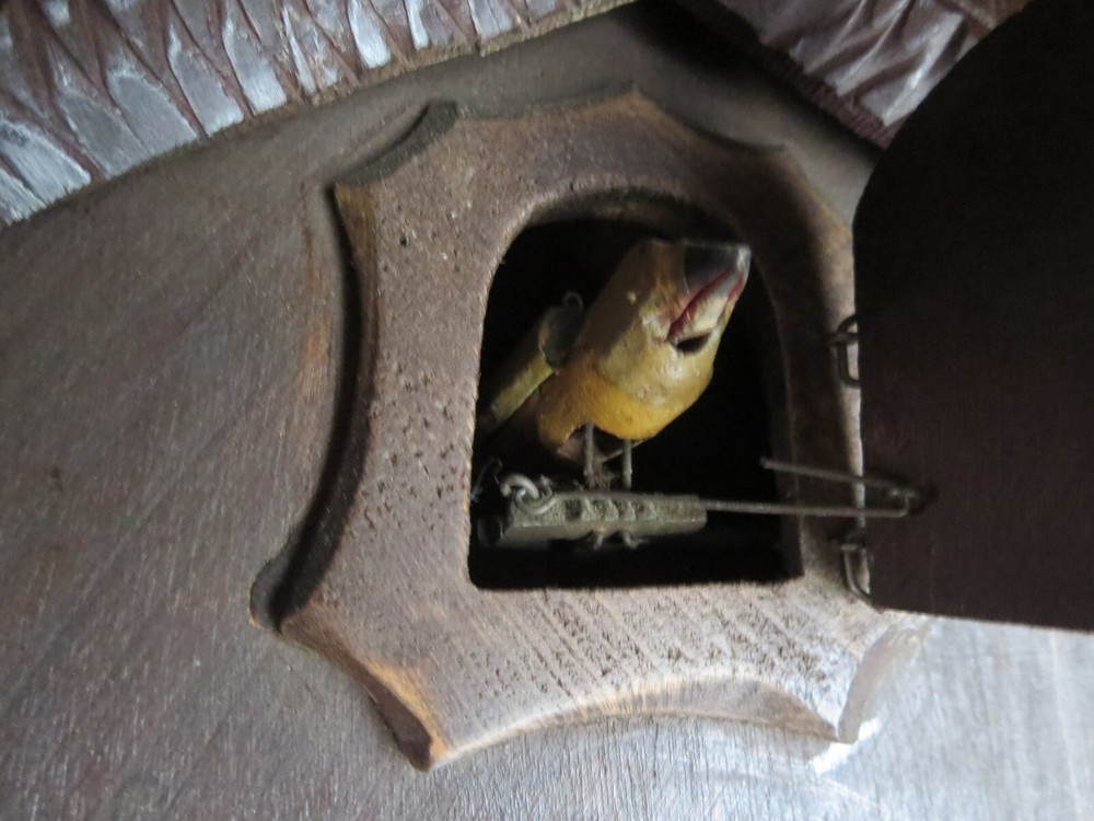 Old Cuckoo clock with articulated bird