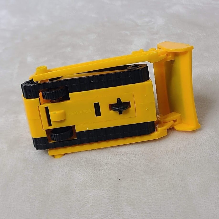 Yellow Plastic Toy Bulldozer With Movable Front Blade