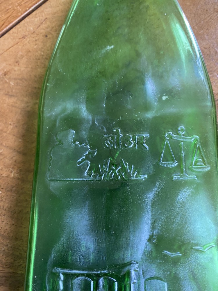 Squashed Green Glass Bottle 23 cms Long with Oriental Design