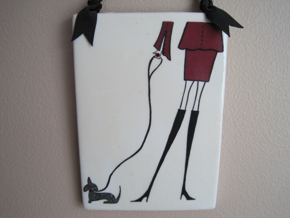 Lady with a dachshund tile.