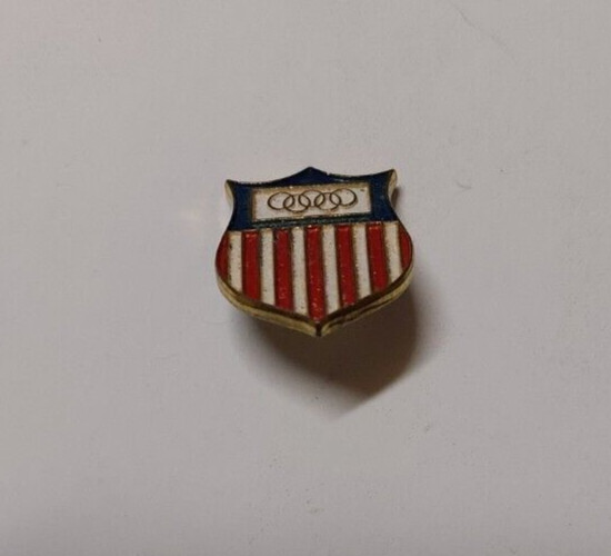 U.S.A OLYMPIC SHIELD SOUVENIR PINBACK. UNKNOWN MAKER. ENAMELED SURFACE