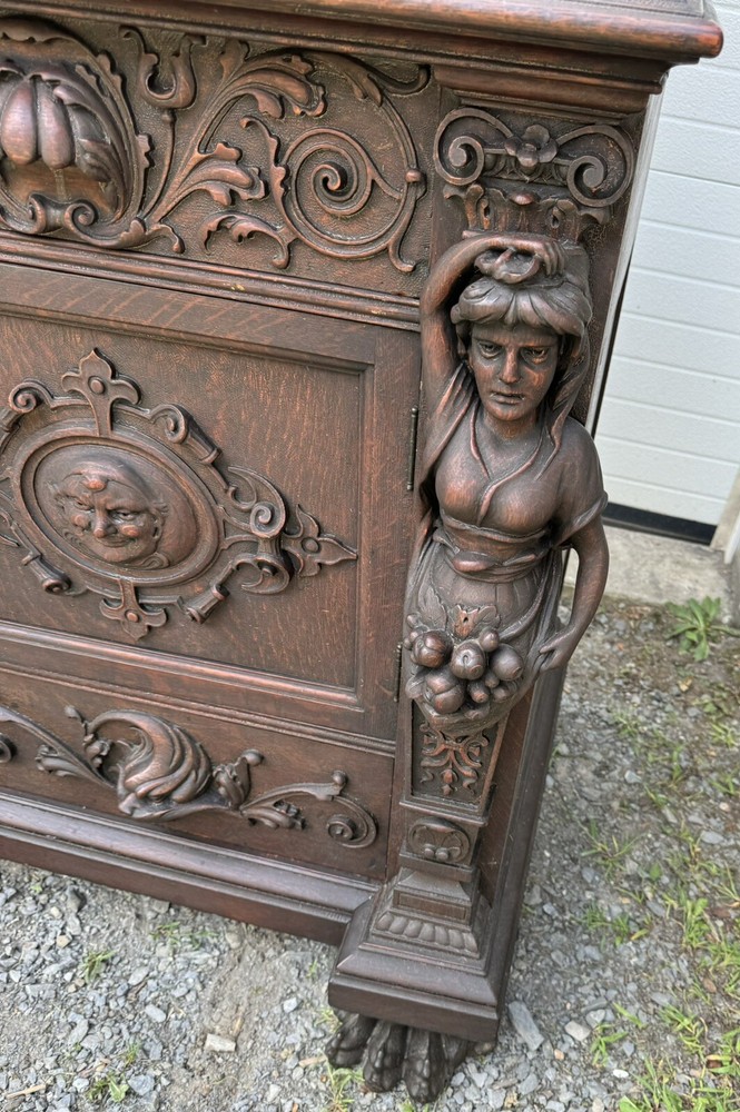 A. J. JOHNSON CARVED FIGURAL OAK SIDEBOARD
