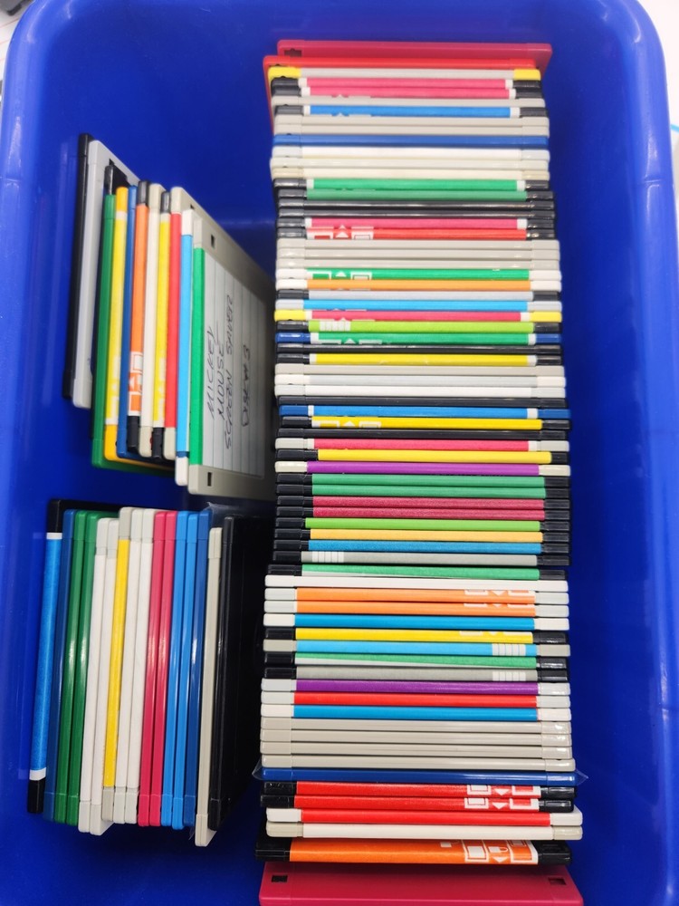 100 unsorted used 3.5" floppy disks various brands and systems.