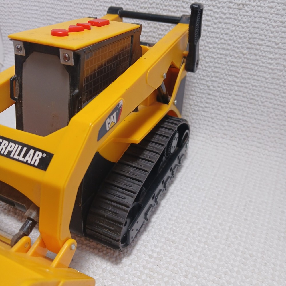 Caterpillar (CAT) toy skid steer loader, likely a "Big Builder". UNTESTED