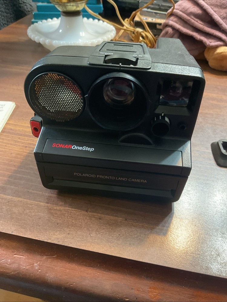 Polaroid Sonar One Step Camera With Model PR-50 And Book And Case untested