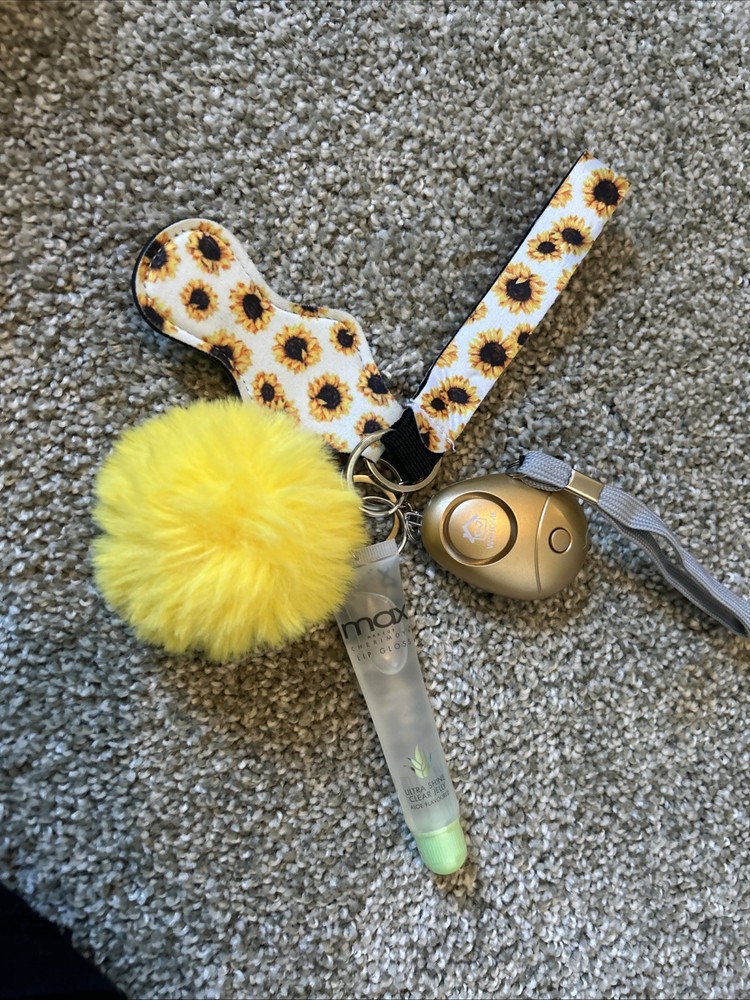 This is a sunflower-patterned self-defense keychain set