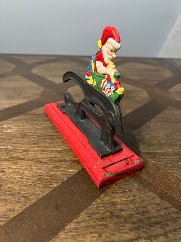 Old Fashioned Nutcracker Cast Iron on Wood Base santa theme nutcracker vintage