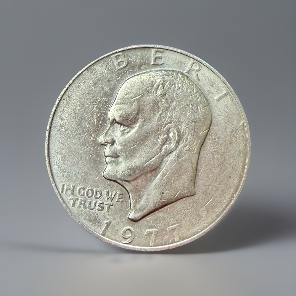 1977-P Eisenhower Ike Dollar - Struck Thru Grease Error