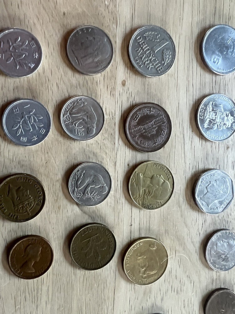 Assorted foreign coins. 26 Coins In Total