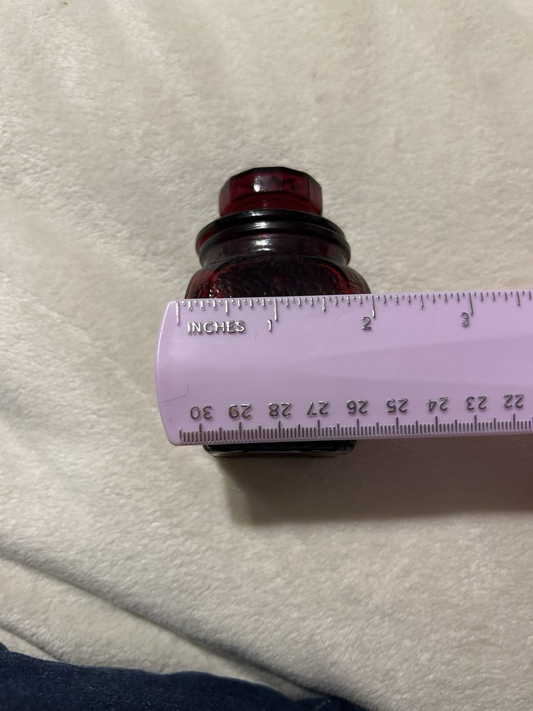 Vintage ruby red apothecary jar With A Textured Finish And Lid With Star Pattern
