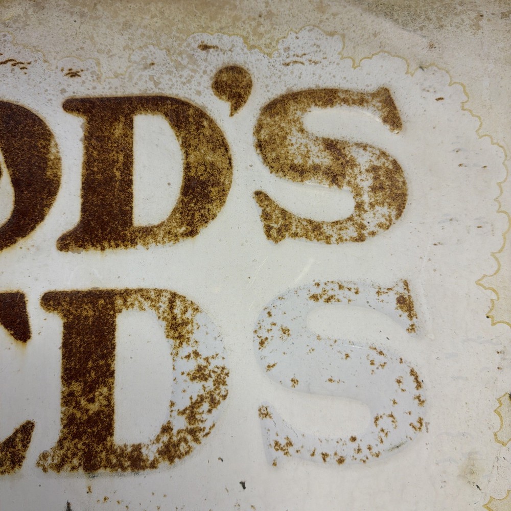 Woods Seeds Embossed Tin Sign