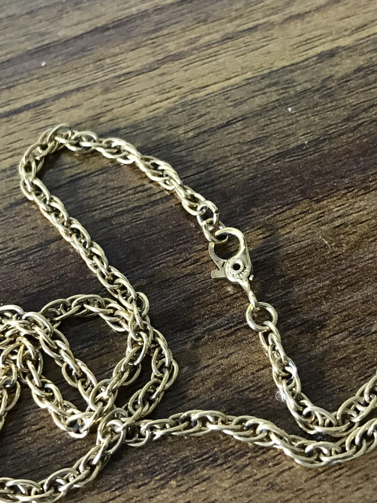 Monet Gold tone Necklace with round Pattern Pendant