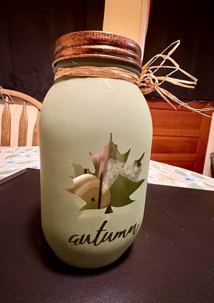 Green Painted Jar With Leaf Design and Lid Cutout