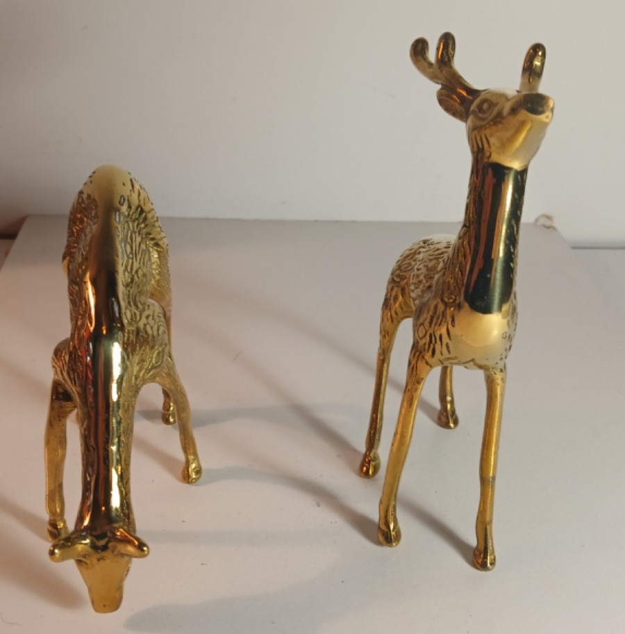 2 Solid Brass Deer. Distributed by Montgomery Ward.