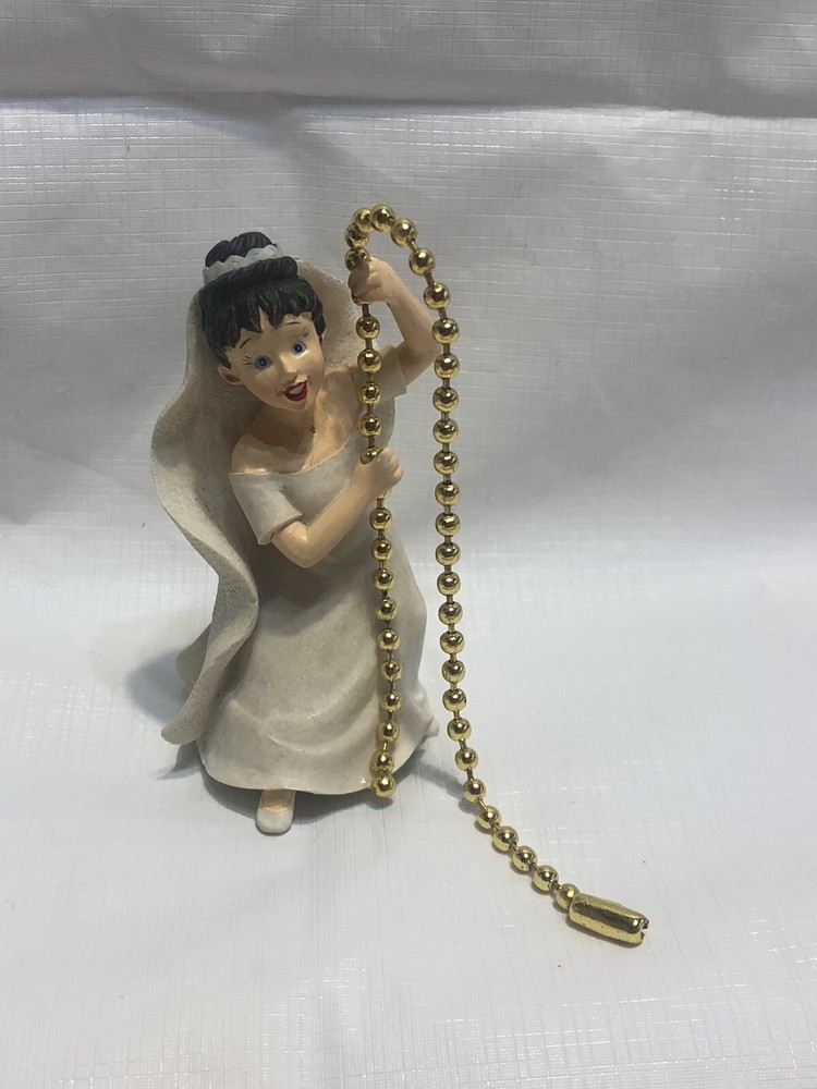 A Decorative Ceiling Fan Or Light Pull Ball Chain  With Bride