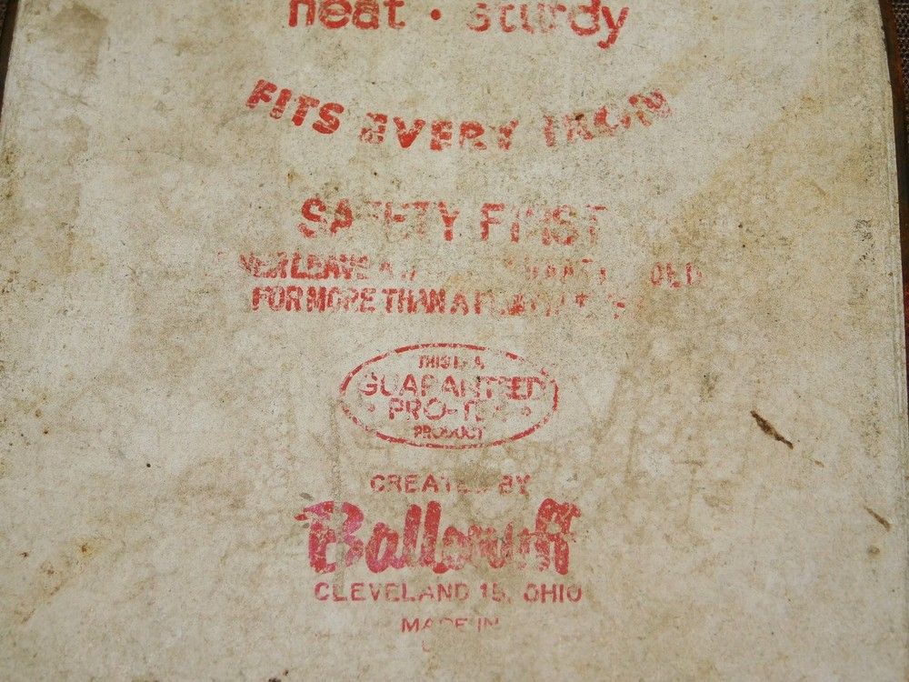 VINTAGE KITCHEN 8 3/4" HIGH SILVER SHIELD IRON REST