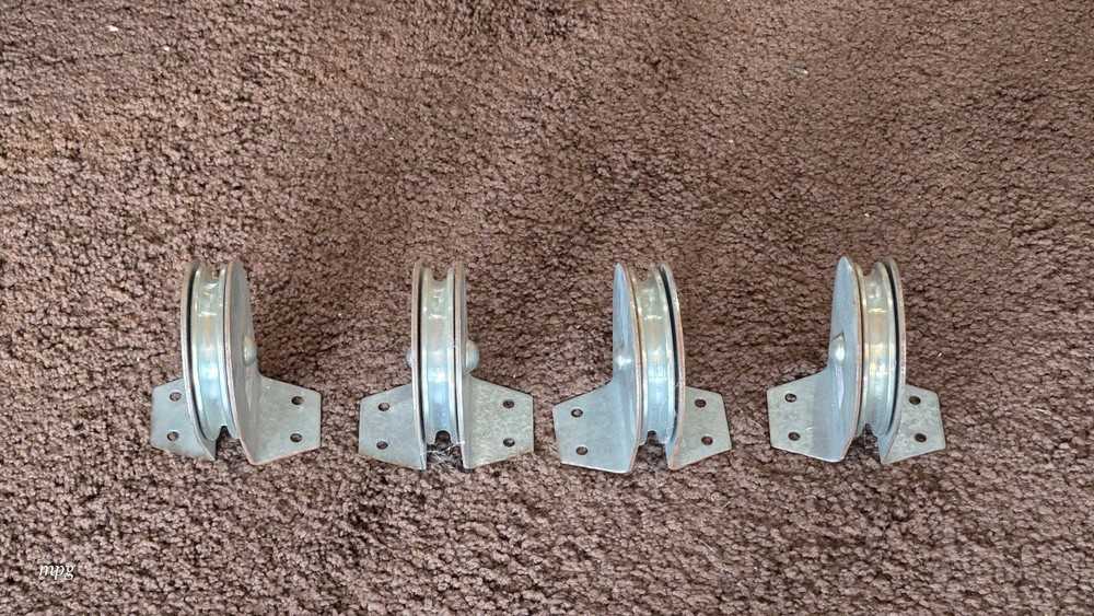 Four 3 - 1/2 inch Flat Mount Pulleys
